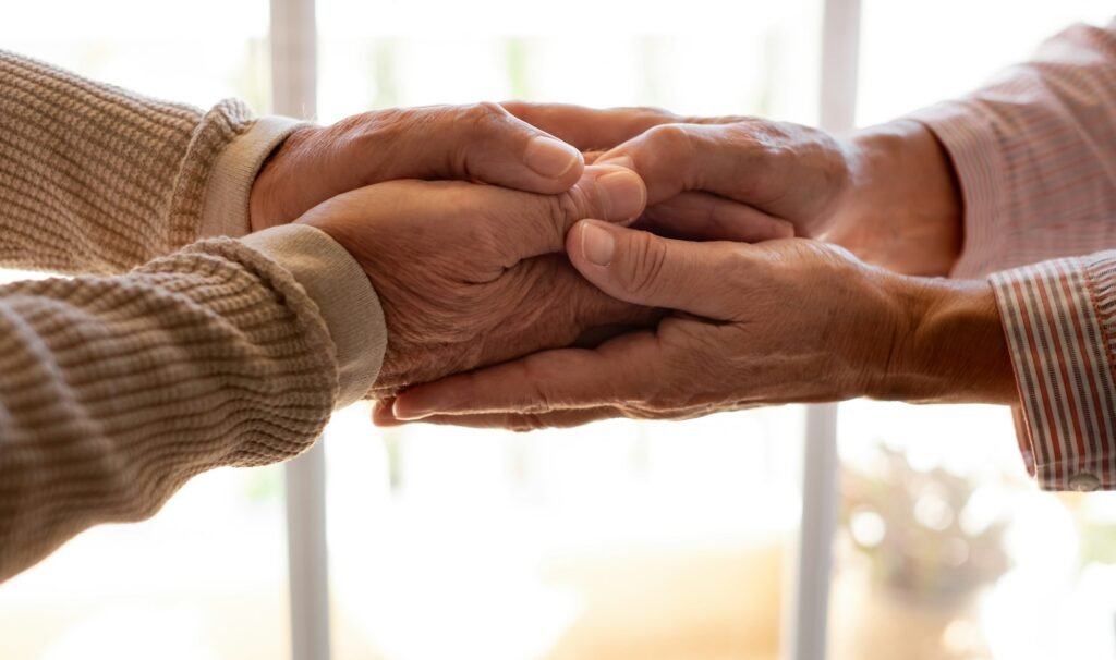 Old people holding hands close up view, senior retired family couple express care and support