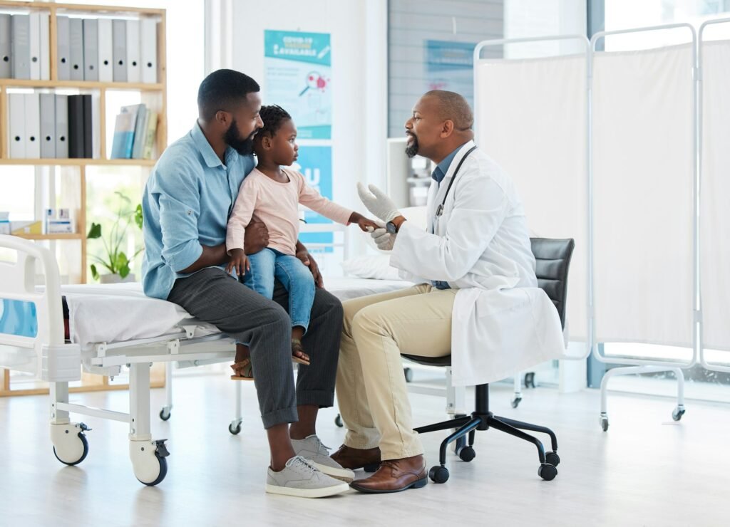 Pediatrician doctor consulting black kid patient for healthcare service, medical help and wellness